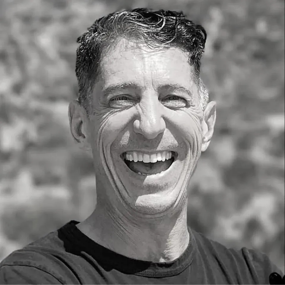 Andy Petranek laughing, black and white portrait